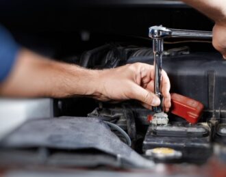Automotive technician performing engine diagnostics in Hamilton ON