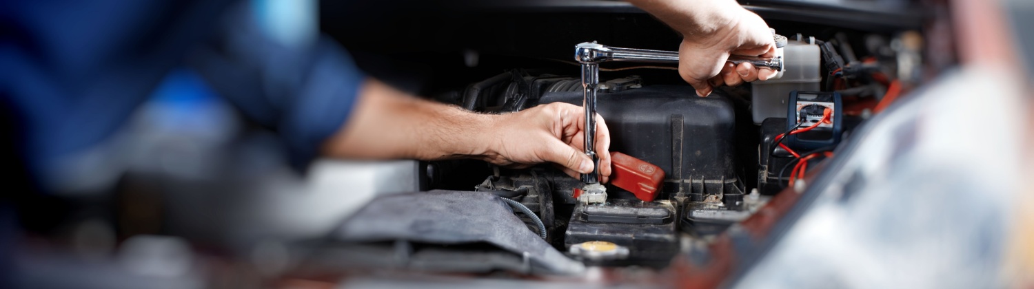 Automotive technician performing engine diagnostics in Hamilton ON